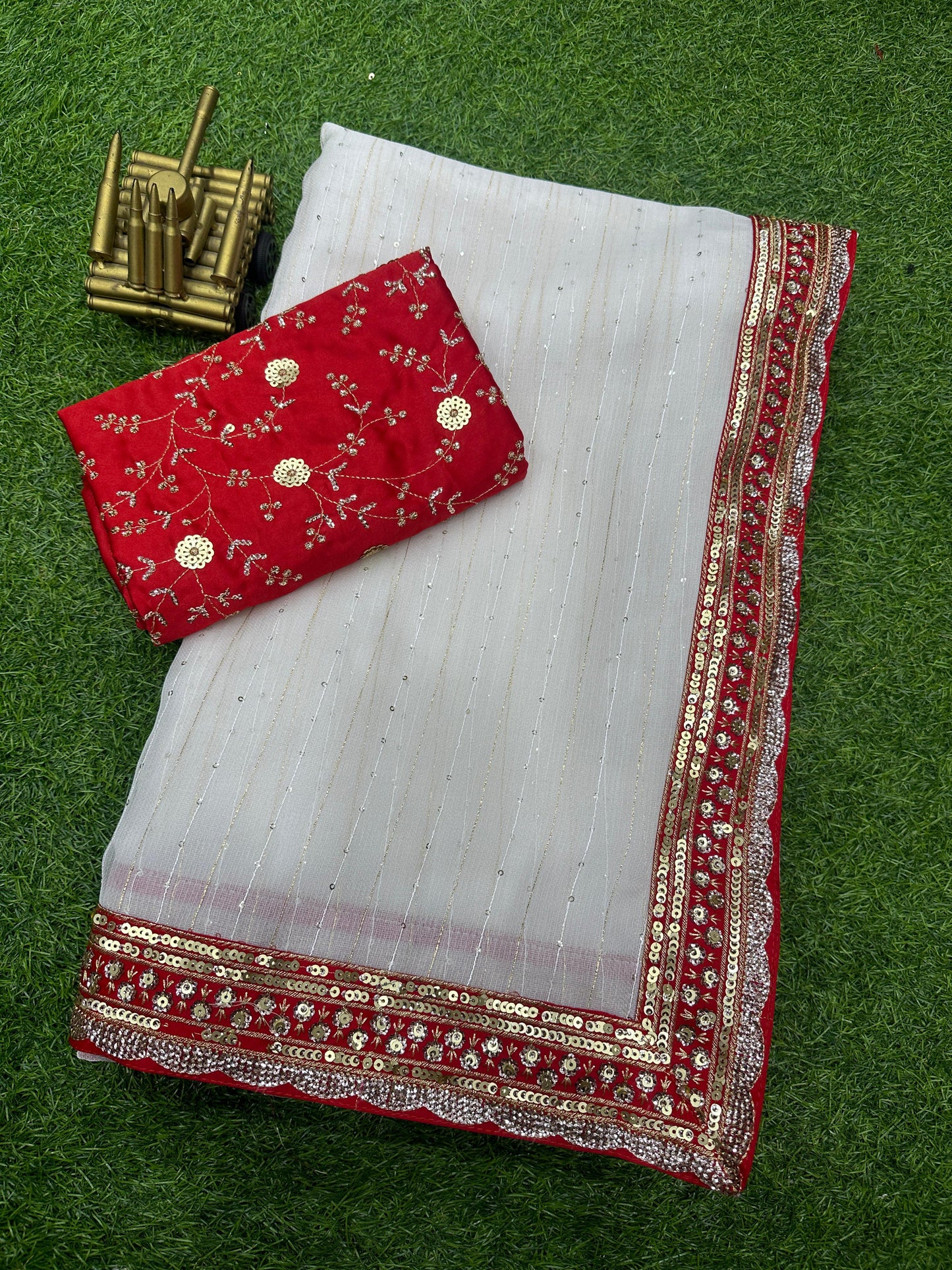 Self sequin weaving saree with contrast red colour sequin work boder.