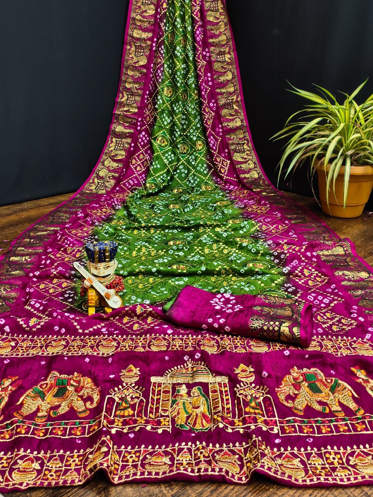 Pure Bandhej silk saree with zari weaving border.
