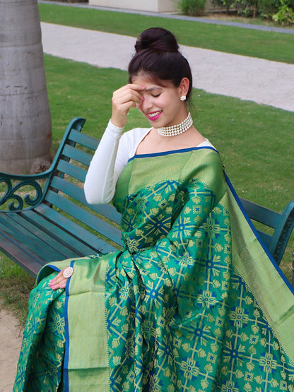 Bandhej silk saree having gold zari border and tassels to pallu with contrast pallu andblouse.